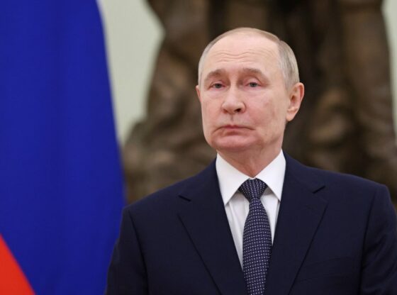 Russia's President Vladimir Putin in a dark suit and patterned tie.