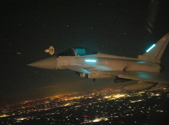 RAF Typhoon FGR4 being refueled by an RAF Voyager over Poland at night.