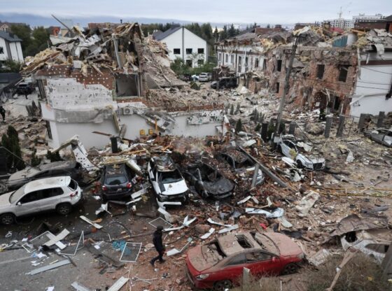 Emergency workers operate at an impact site in a residential neighborhood after drone and missile attacks in Kyiv, Ukraine.