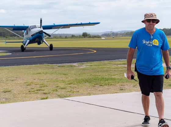 Paul Smith, the 54-year-old pilot, walks away from the plane after conducting a skydiving drop.