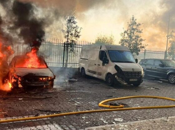 Cars on fire at a residential building after a Russian drone strike in Kyiv.