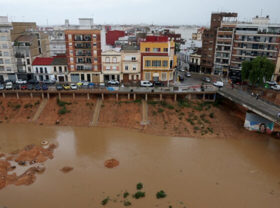 Aerial view of the Poyo ravine overflowing with muddy water after heavy rainfall in Paiporta, near Valencia, Spain.