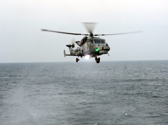 A Wildcat helicopter from HMS Lancaster hovers above the sea during a drug seizure operation.