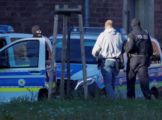 A suspected foreign operative of Hamas is escorted by police after arriving by helicopter at Germany's German Federal Public Prosecutor in Karlsruhe, Germany.