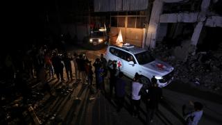 Red Cross cars transport the last four bodies delivered by Hamas.