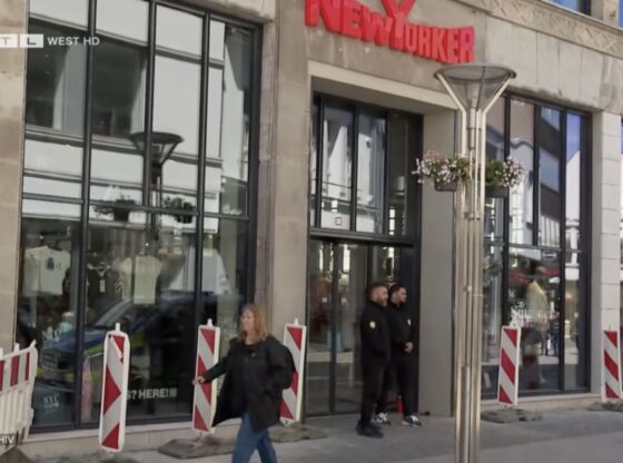 An image collage containing 1 images, Image 1 shows Exterior of the New Yorker fashion store in Krefeld, Germany, where a knife attack occurred