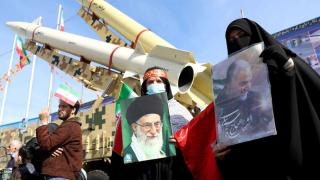 A group of Iranians celebrate the anniversary of the Islamic revolution in Tehran.