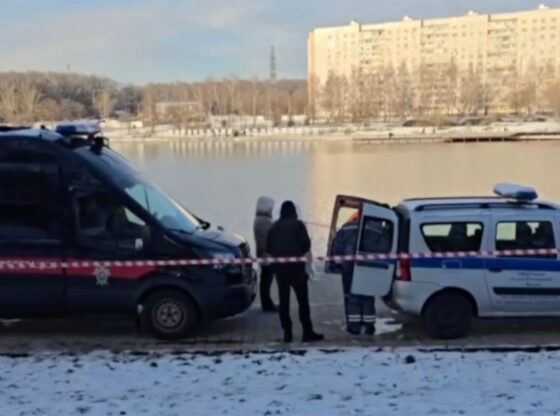 An image collage containing 1 images, Image 1 shows Police vehicles and personnel by a body of water in winter