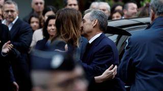 Nicolas Sarkozy and his wife, Carla Bruni, say goodbye before entering prison.