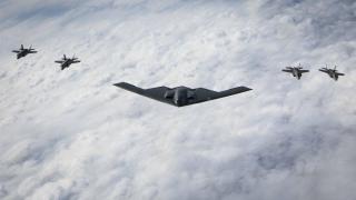 B-2 Spirit bomber escorted by F-35 fighters