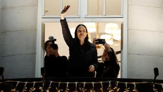 Nobel Peace Prize winner María Corina Machado gestures from the balcony of the Grand Hotel in Oslo, Norway, on December 11, 2025.