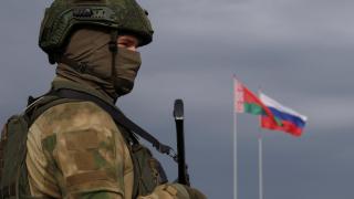 A member of the Belarusian Army stands guard at a training ground during the joint Russia-Belarus military maneuvers Zapad-2025, near Borisov.