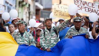 Hundreds of Chavistas demonstrate in Caracas to protest against the confiscation of an oil tanker in waters near the country.