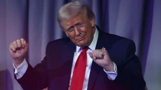 Donald Trump dances as the Village People perform during the 2026 FIFA World Cup draw.