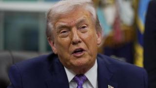 US President Donald Trump speaks as he signs an executive order on artificial intelligence in the Oval Office of the White House in Washington, DC, US, on December 11, 2025.