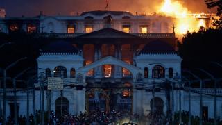 The office of the Nepalese prime minister, on fire.